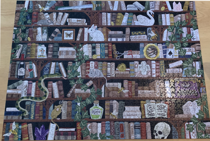 puzzle of a bookshelf with trinkets